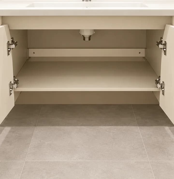 Open Y-40 cabinet showing internal storage, shelf and basin plumbing space